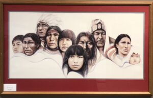 A painting of native americans in a frame